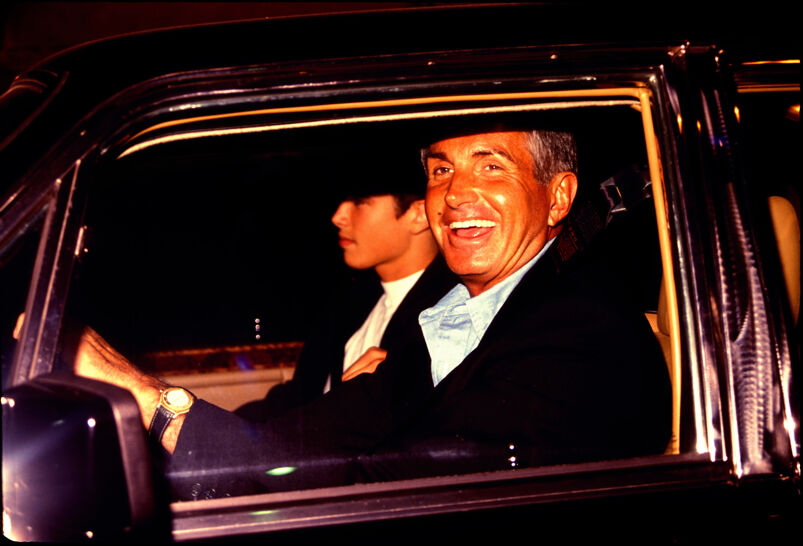 Actor George Hamilton is spotted driving his car.