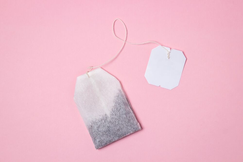 Tea bagging like you've never seen before: Tea bags on a pink background. A quick way to brew tea. Morning drink