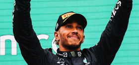 Racing legend Lewis Hamilton stands up for LGBTQ+ rights in the Middle East & looks smokin’ hot while doing so