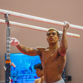 Star gymnast Sam Phillips is a team captain & attributes his success to coming out as bisexual