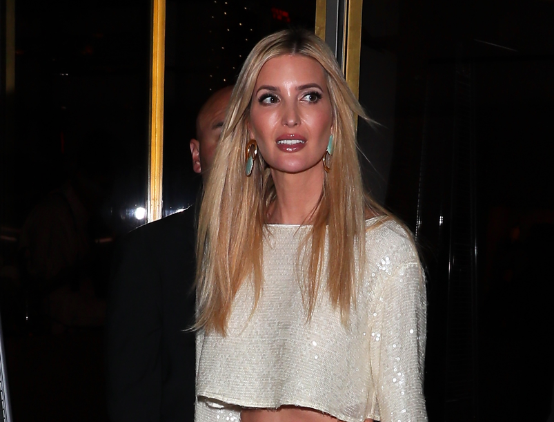 Ivanka Trump wearing a sparkly white dress walking out of a restaurant