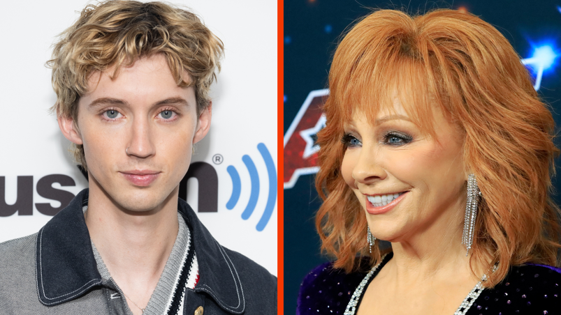Two panel image. On the left, Troye Sivan poses in front of a Sirius XM sign. He has a nose ring in his right nostril, wears a denim and gray collared shirt, and has messy blonde hair over dark roots parted in the middle. On the right, Reba McEntire smiles into the distance at an 'America's Got Talent' event. She wears a black sparkling gown with a silver jeweled collar and long, dangling silver earrings.