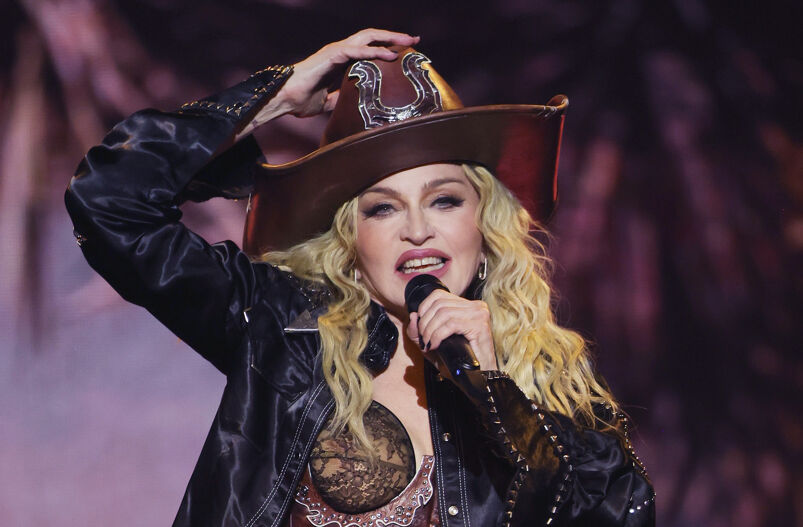 Madonna in a cowboy hat on stage