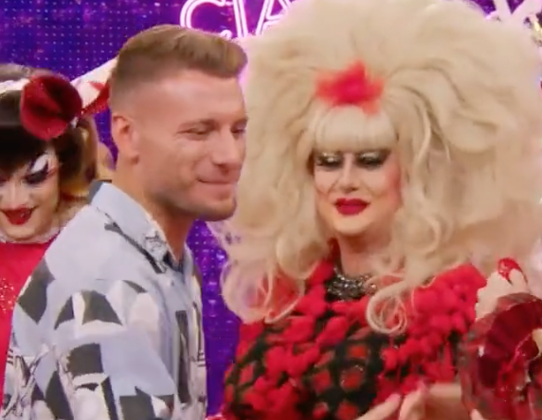 Ciro Immobile on the set of Drag Race Italia shaking hands with drag queens