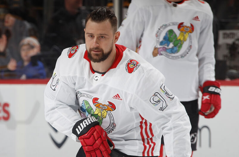 New Jersey Devils player Thomas Tatar skating in a Pride jersey. 