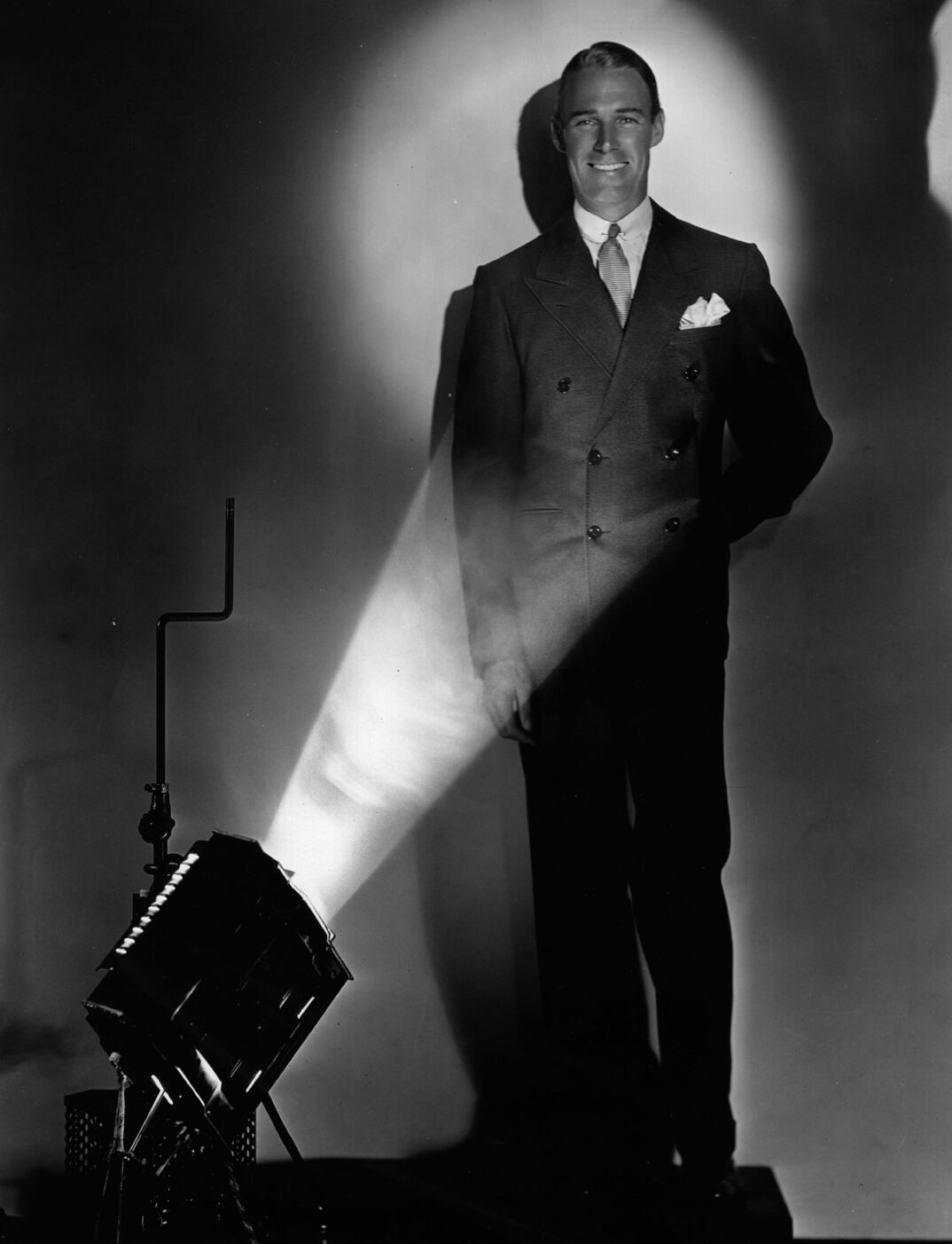 American actor and film star Randolph Scott (1903 - 1987) in the spot light.    (Photo by Hulton Archive/Getty Images)