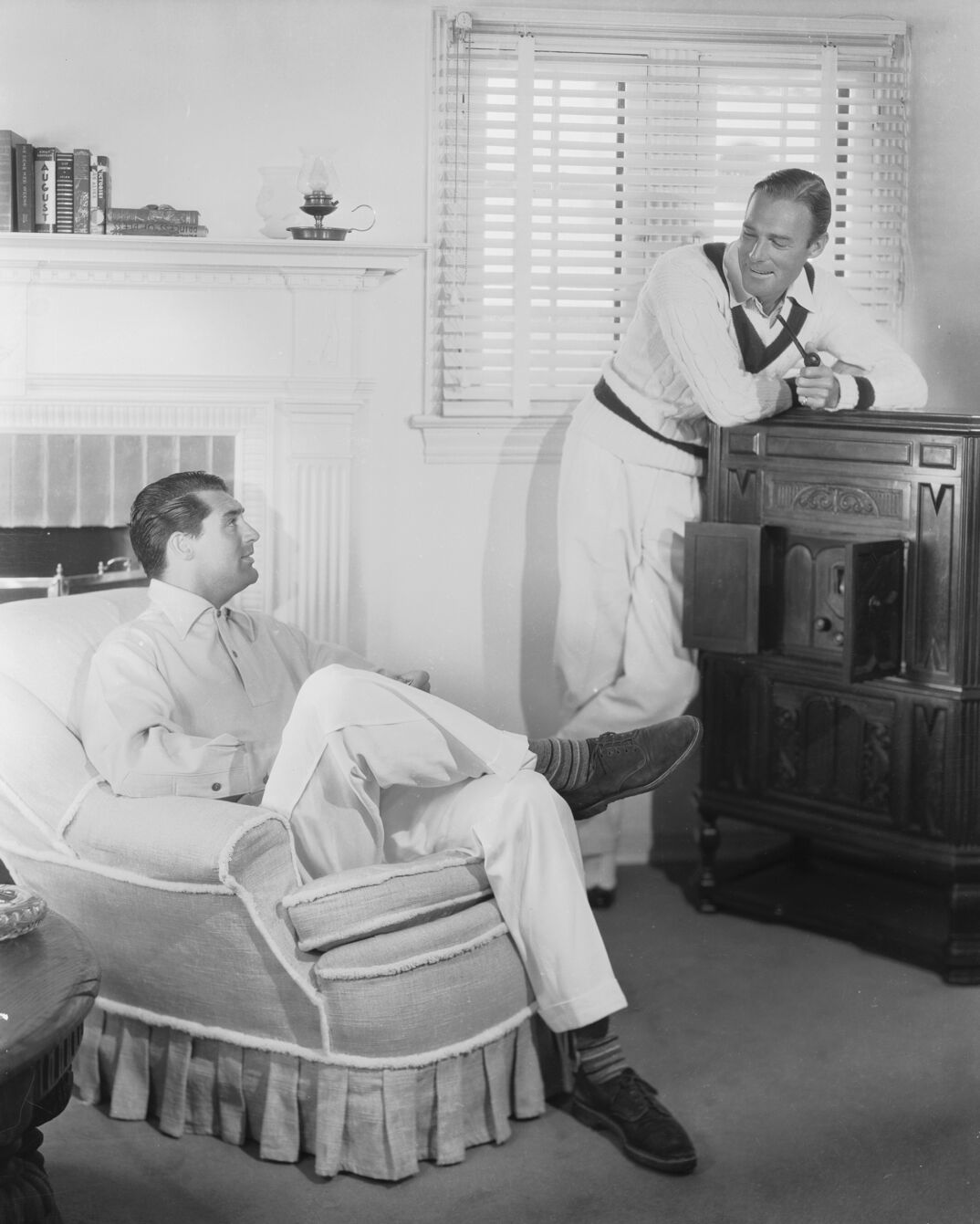 1935:  British born actor Cary Grant (1904 - 1986), born Archibald Leach, with the American actor, Randolph Scott (1898 - 1987). The two stars shared a beach house during the 1930's, which was jokingly known as Bachelor Hall.  (Photo via John Kobal Foundation/Getty Images)