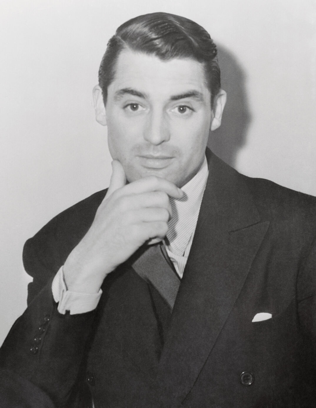 (Original Caption) Cary Grant, film star, is pictured as he appeared in court, December 12th, answering the suit of Virginia Cherrill who seeks $1,000 a month pending hearing of her suit for separate maintenance. Judge Dudley S. Valentine awarded Miss Cherrill $167.50 a week from Grant and ordered him to pay attorney's fees and court costs, pending trial of her suit. Miss Cherrill charged that Grant showed no concern for her welfare or comfort.
