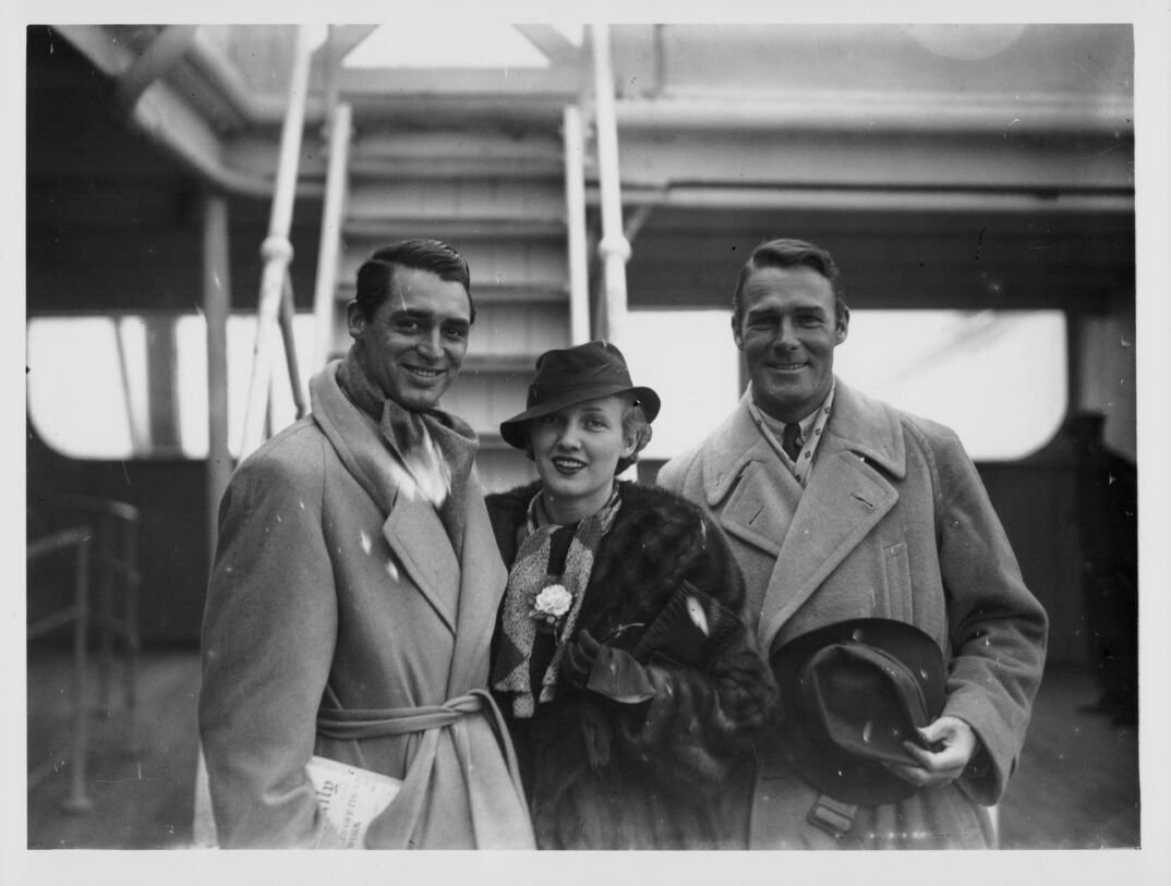 Actors Cary Grant, Randolph Scott And Virginia Cherrill aboard the SS Pars on its arrival at Plymouth, England, November 24th 1933. (Photo by Keystone/Hulton Archive/Getty Images)