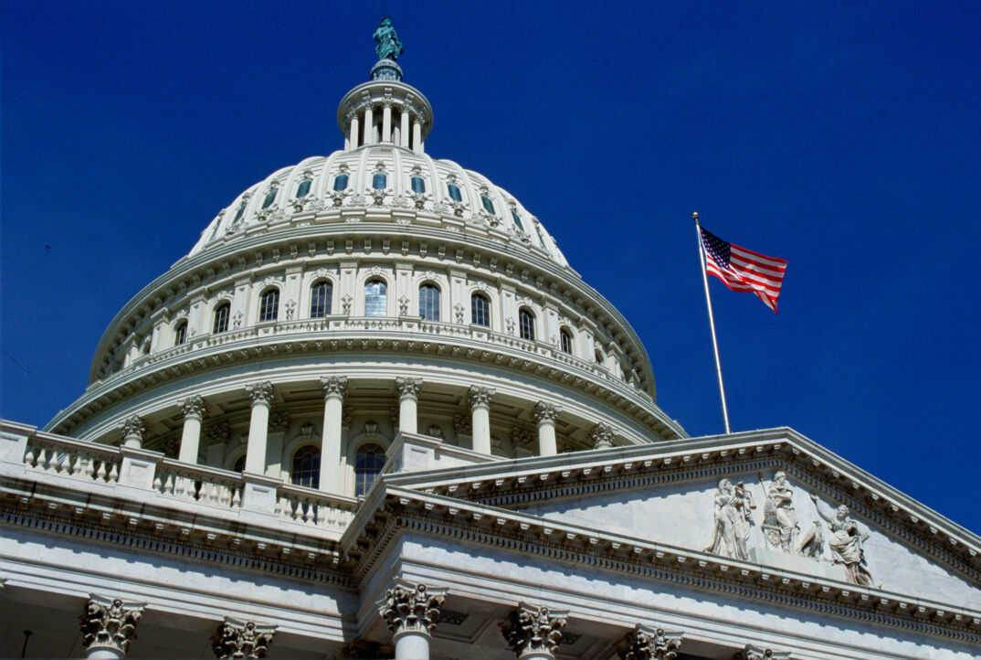 WASHINGTON, UNITED STATES - JANUARY 01:  The stars and stripes flag flying at the Capitol Building, Washington, USA.