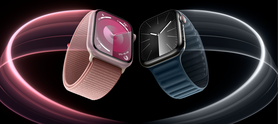 Two Apple Watches, with square faces with glass and touch sensitive faces, are pictures in resting against each other in an illustrated advertisement. The left watch has a pink textured band, with a pink swirl behind it. The right watch has a black textured band, with a chrome-colored swirl behind it, connecting to the pink swirl.