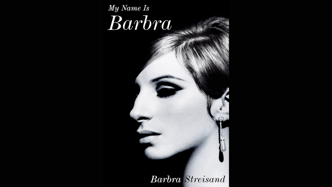 A close up of the book cover of "My Name is Barbra," featuring a black and white photo of Barbra Streisand with thick fake lashes and her hair behind her ears. The title is featured in white and flowing letters.