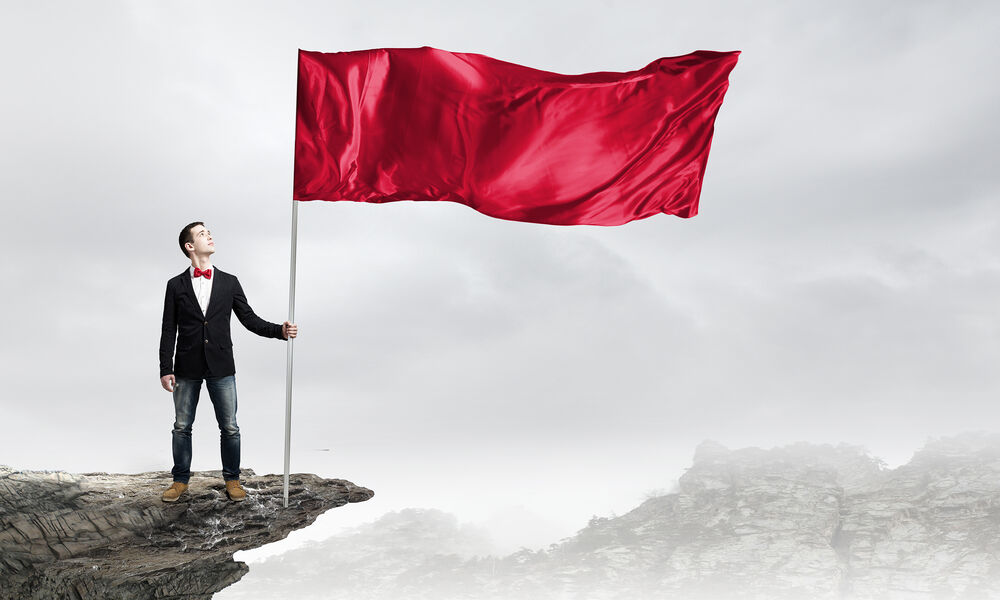 Man with red flag