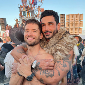 Real-life husbands Julian Morris & Landon Ross play soldiers in love in super queer ‘Dancing in Babylon’ music video