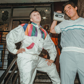 Cole Escola & Conrad Ricamora go back in the closet to dish on being queer, playing dress-up & more
