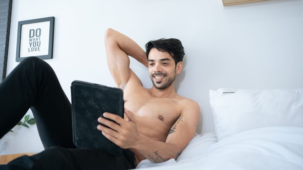 Smiling man looking at tablet