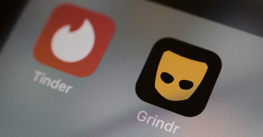 Grindr and Tinder on a phone screen