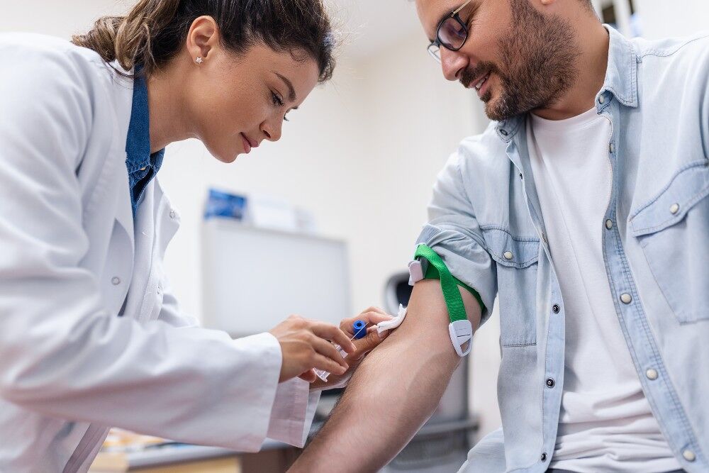 A men receives a blood test at a clinic