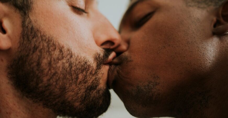 Two gay men kissing