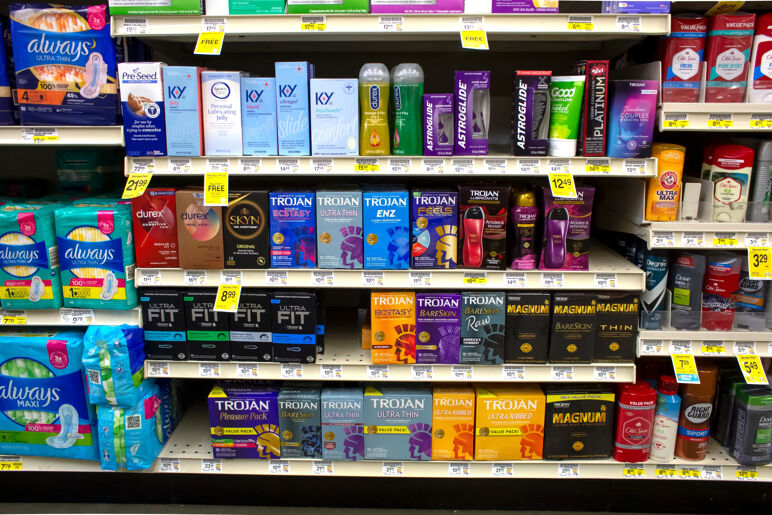 A view of several shelves dedicated to sexual wellness products, on display at a local retail store.