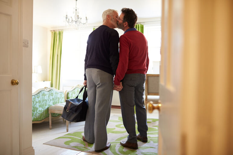 Gay couple at hotel