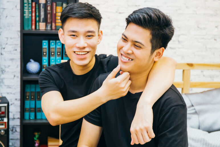 Smiling gay couple