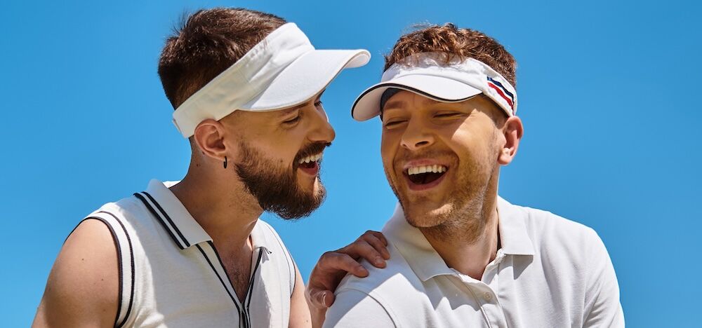 Smiling young tennis players