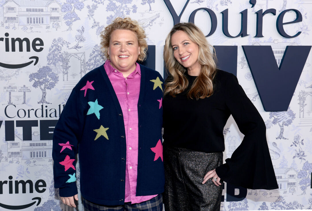 Fortune Feimster stands next to ex-wife Jacquelyn Smith on the red carpet.