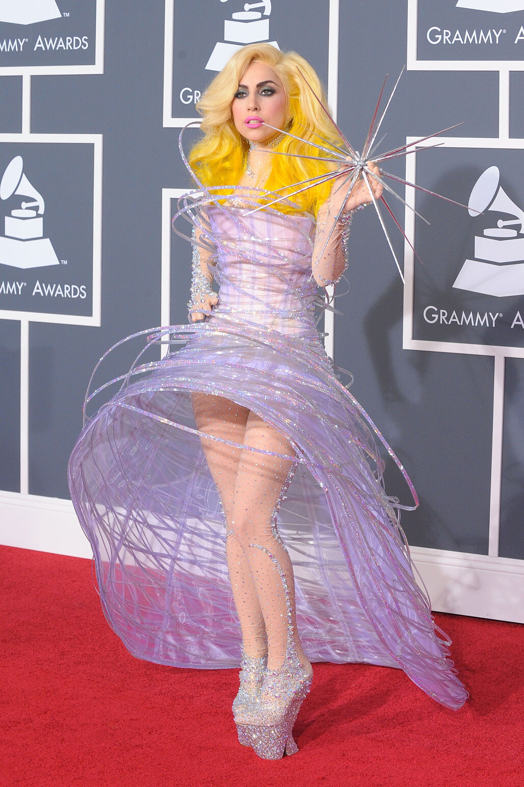 Lady Gaga at the 2010 Grammys, wearing a spiraling and three-dimensional light purple Armani dress.